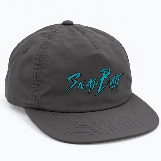 SnapBait Quick Dry Cap in charcoal, three-quarter front view with teal SnapBait logo and flat brim