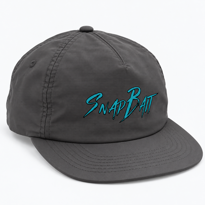 SnapBait Quick Dry Cap in charcoal, three-quarter front view with teal SnapBait logo and flat brim