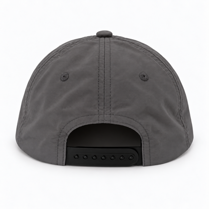 SnapBait Quick Dry Cap in charcoal, back view showing the adjustable snapback strap and vent eyelets