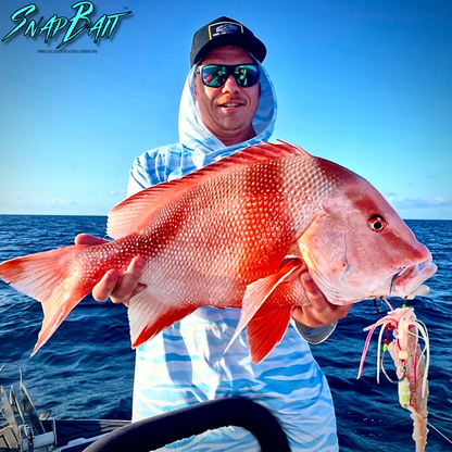 Angler holding large red Emperor caught using SnapBait Australia Hybrid Jigs fishing lure